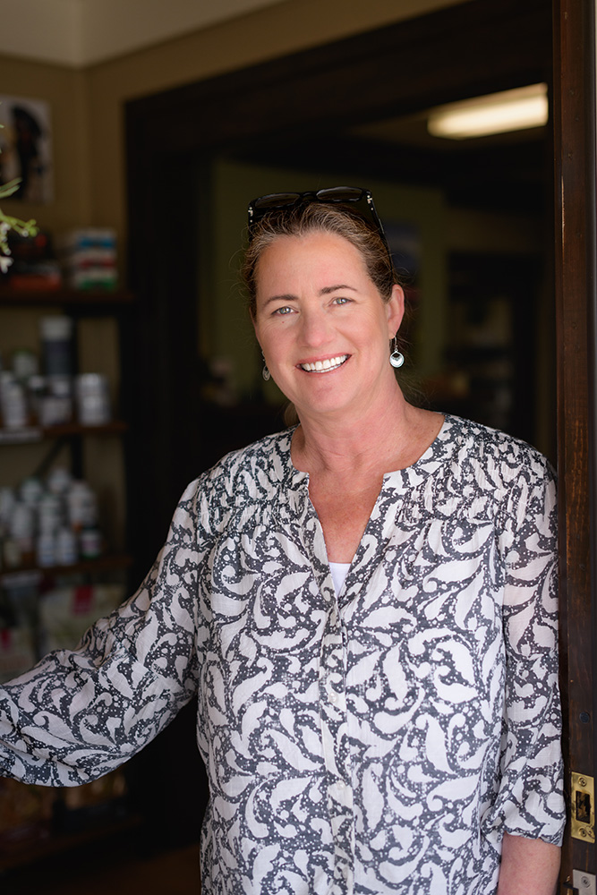 Headshot of Dr. Anja Hunter in doorway of Animal Wellness Veterinary Clinic a holistic vet in Boise, Idaho